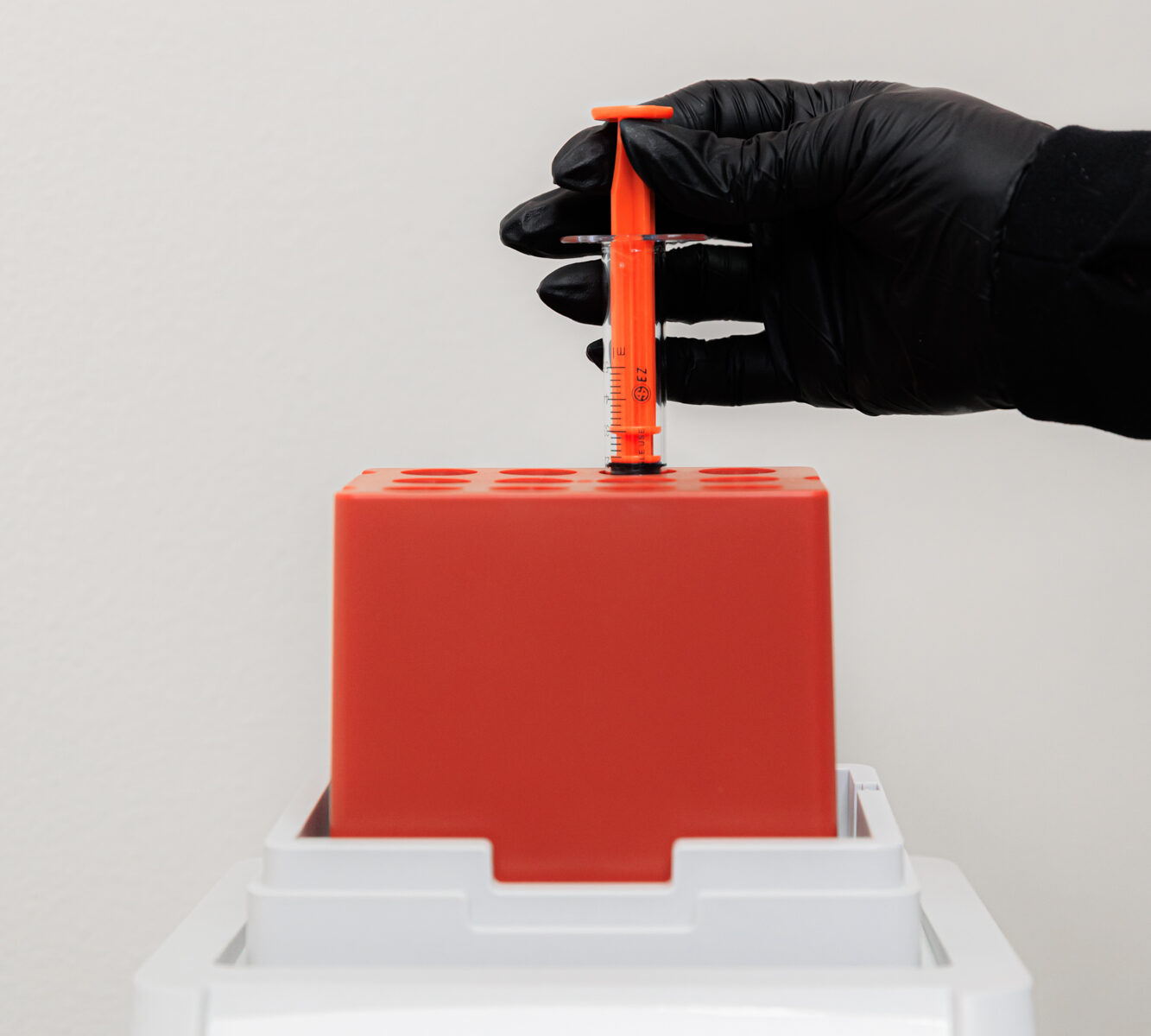 A hair loss specialist in Coeur d’Alene prepares a treatment