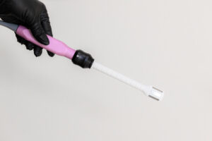 A provider with gloves uses a probe to administer a treatment with FormaV near Hayden.