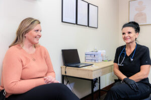 A patient and a provider talk about treatment options during a consultation for holistic medicine in Coeur d’Alene.